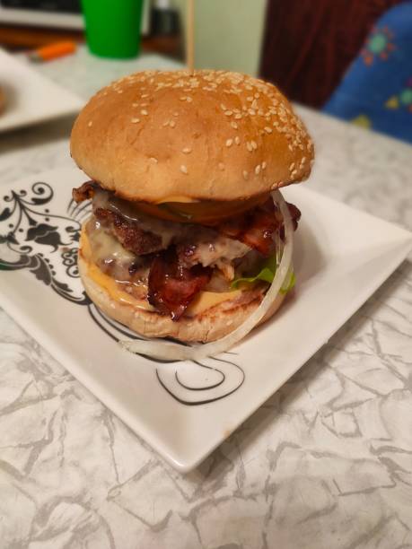 istock delicious juicy burger, sesame bun, lettuce, meat cutlet 2203033729