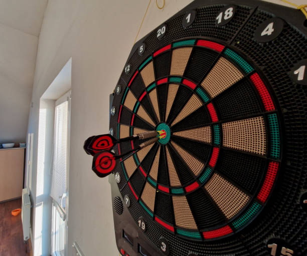 istock game include cricket,a game for two teams in which the players alternate between scoring inner bull's eyes and points; football, a game for two players 2203033920