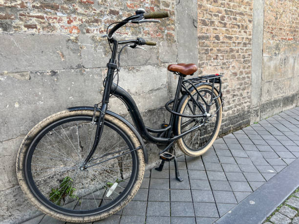 istock old vintage bicycle lean on wall in the street 2203034687