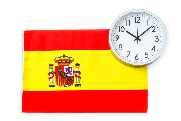 istock Round clock and flag of Spain, isolated on white background. Time to learn Spanish language. 2203035053