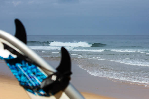 istock Cinematic scene of a surfer doing a great trick 2203035990