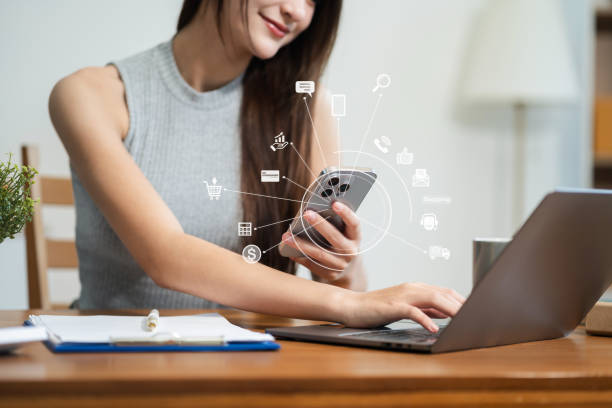 istock Startup small business entrepreneur or freelance using a smartphone and laptop with box, checking orders from customers. 2203036896