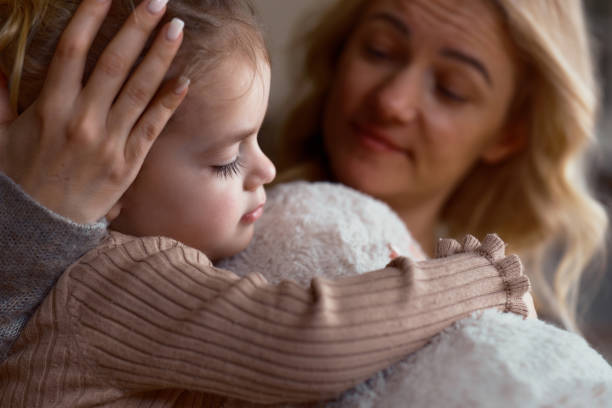 istock A mother hugs her sweet daughter 2203042412