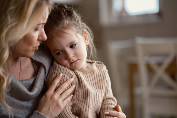 istock A mother comforts her sad daughter 2203042643