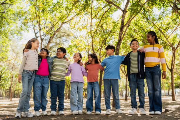 istock Child friends talking embraced on public park 2203044699