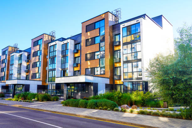 modern residential building in contemporary architecture. landscaping for urban spaces. - apartman stok fotoğraflar ve resimler