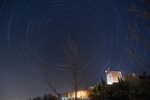 istock Star trails over the alhambra in granada, spain, during a clear night 2203045329
