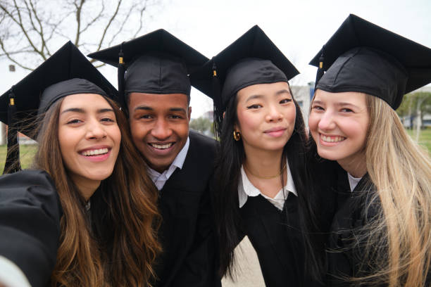 istock Happy multi-ethnic graduates taking a selfie celebrating their graduation 2203046628