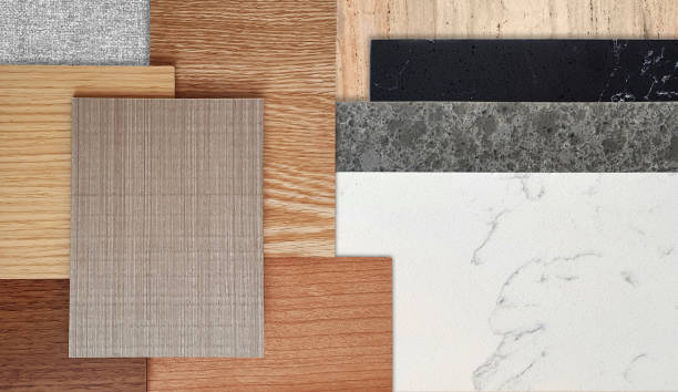 istock interior material samples board in close up view including black, gray and white artificial stones, set of wooden laminated flooring tiles. 2203046960