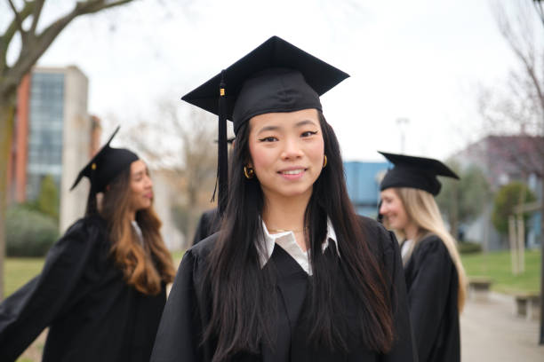 istock Young asian student smiling at graduation ceremony 2203047540