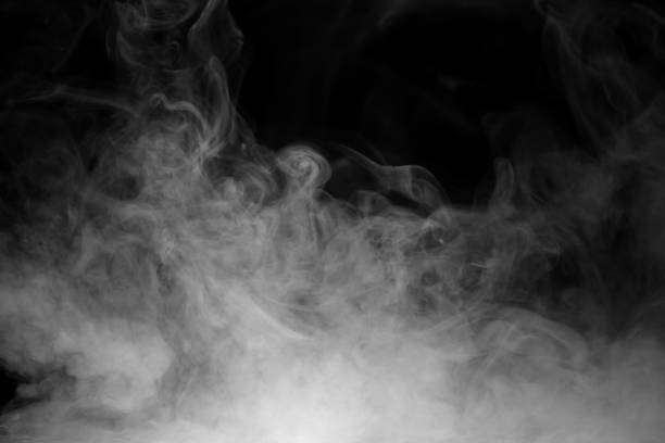 istock White smoke isolated on black background, motion blur 2203049396