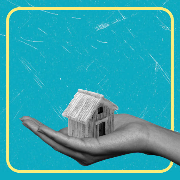 istock Contemporary art collage featuring a hand with a house. 2203050732