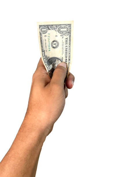 istock Hand holding one dollar banknote on white background 2203054017