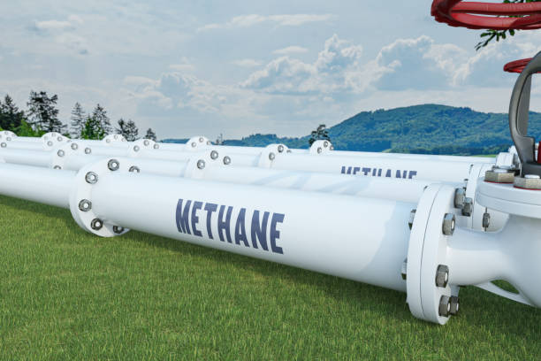 istock Methane Pipeline on Green Grass Field 2203054713