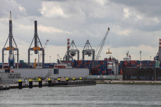 istock Cargo container ship at a container terminal in Rotterdam port, Netherlands 2203055040