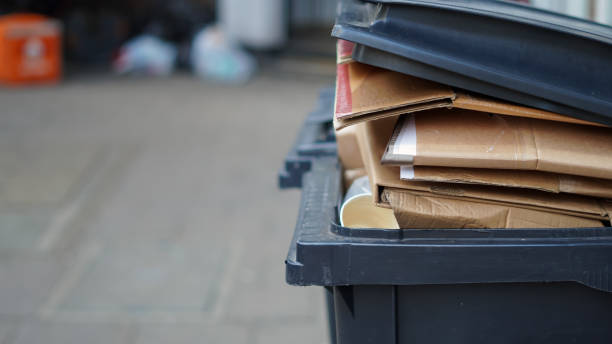 istock Stacked cardboard sorted outdoors for recycling, waste management concept 2203055903