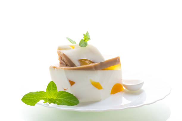 istock milk jelly dessert with fruit pieces 2203060680