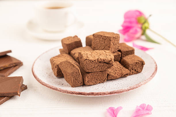 istock Chocolate marshmallow with cup of coffee on white wooden. side view, selective focus 2203061049
