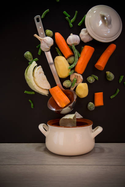 Vegetables in motion before cooking in soup.