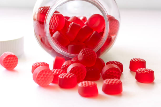 istock Vitamin B12 Chewable Gummies Spilled from a Bottle 2203061323