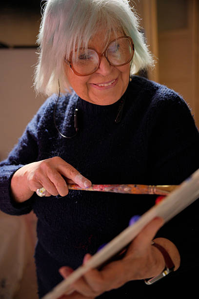 senior artist painter with brush in hand