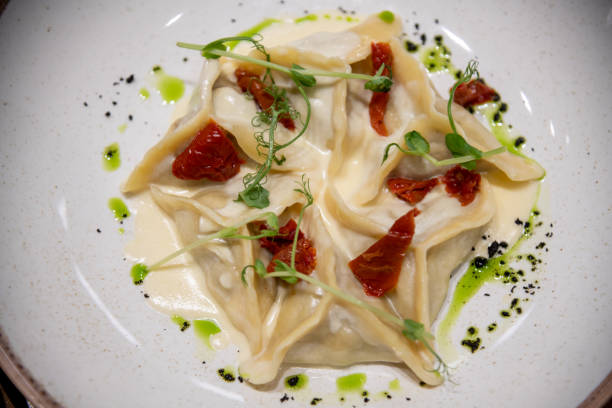 istock Delicious pasta dish served at a cozy cafe during evening hours 2203063416