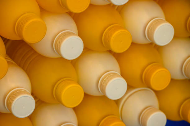 The group of orange plastic bottles container. The hi-technology of drinking water manufacturing process concept.