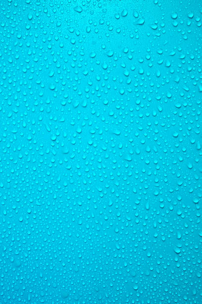 istock Drops on turquoise background. Water drops on bright blue background. 2203066214