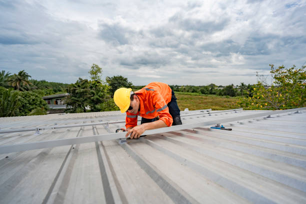 istock Technician in safety uniform and helmet kneeling on a rooftop, using a drill for precise installation work. A scene highlighting safety, professionalism, and technical expertise in construction. 2203067226