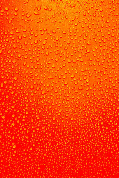 istock Drops on orange background. Water drops background. Peach colour, orange texture bubbles. 2203067275