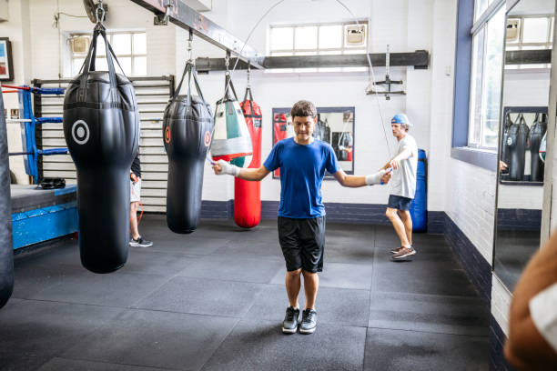 istock Young boxer skipping rope at youth club 2203067862