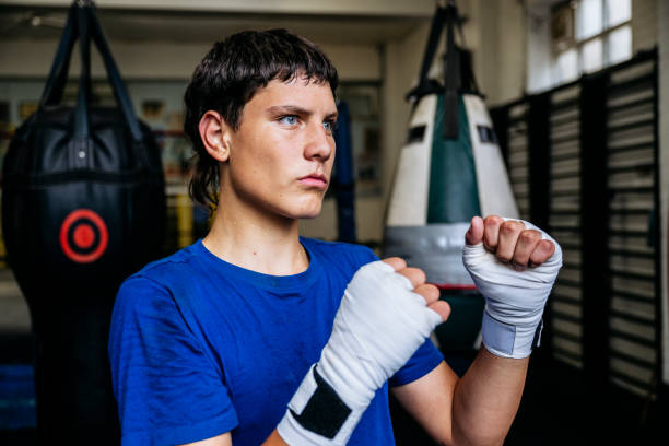 istock Three-quarter front view of young boxer keeping his hands up 2203067951