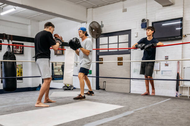 istock Training with focus mitts at youth boxing club 2203068149