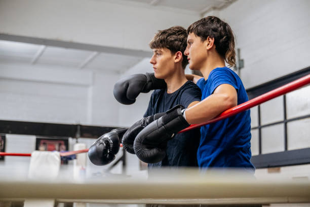 istock Young male sparring partners watching activity in the ring 2203068156
