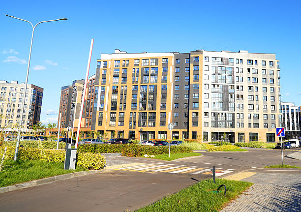 istock Automatic car barrier in Private urbanization residential area. Condominium complex with apartments in courtyard. 2203068223
