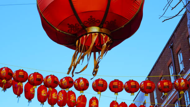 istock Symbolic Chinese red lanterns hanging in a row, representing prosperity 2203068662