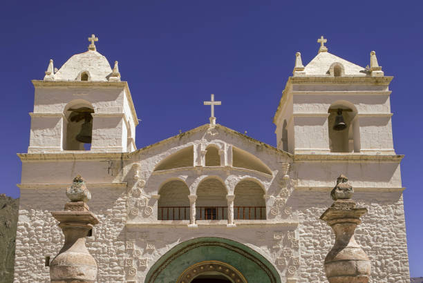 Colonial Charm in Maca: Pristine White Church Against a Brilliant Blue Sky
