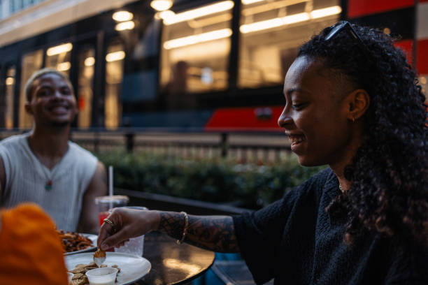istock Friends sharing a meal outdoors with smiles and good vibes 2203070614