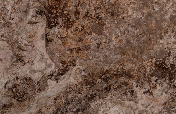 istock Rough natural stone texture in browns and ochres, close-up 2203070800
