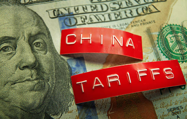 istock China and Tariff labels on a US hundred dollar bill 2203070929