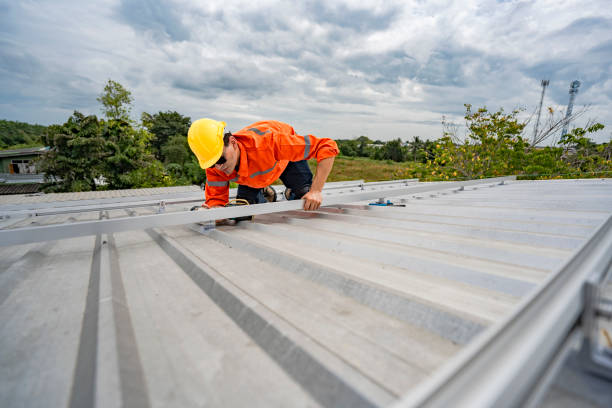 istock Technician in safety uniform and helmet kneeling on a rooftop, using a drill for precise installation work. A scene highlighting safety, professionalism, and technical expertise in construction. 2203070960