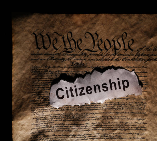 istock Citizenship newspaper headlines on the US Constitution -- 14th amendment immigration law 2203071500