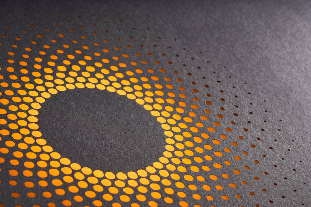 istock Abstract circular halftone paper cutout design with black surface and metallic orange underlay for modern aesthetics 2203071859