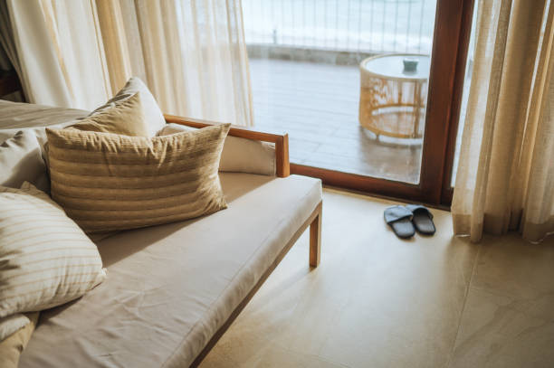 istock luxurious beachfront resort room with ocean view and cozy seating area 2203074074