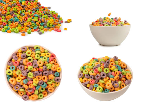 istock Colorful rings cereal spill out into a bowl. Breakfast. Isolated. 2203078022