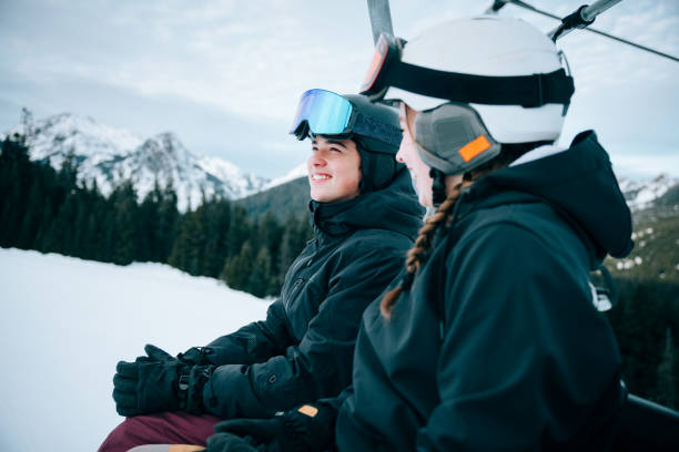 istock Snowboard Teens At Mountain on Chairlift 2203081308