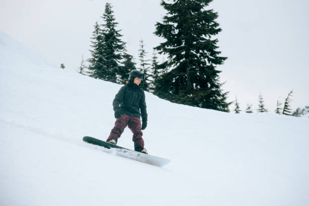 istock Teen Snowboarding Down Mountain 2203081409