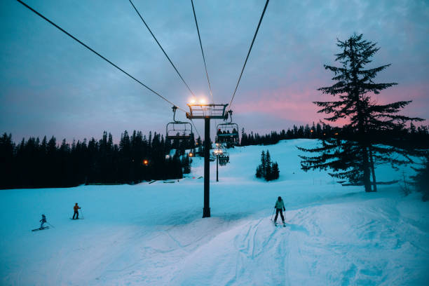 Bright lights illuminate the ski slopes at the Summit at Snoqualmie pass in Washington state, USA.  A fun and healthy evening activity away from the city.