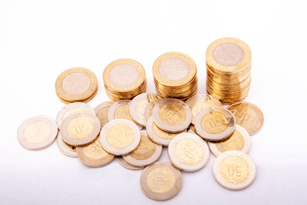 istock Close-up of coins stack on white background. Saving money concept. 2203086997
