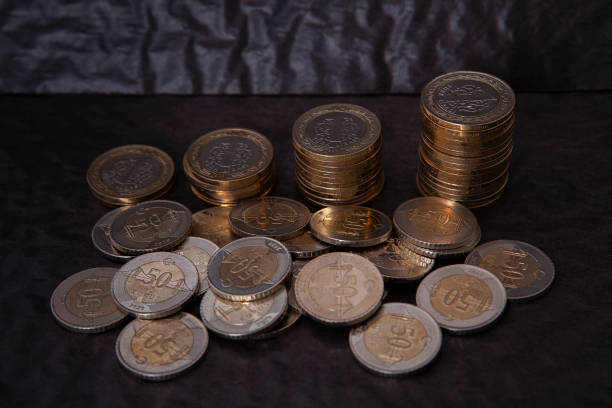 istock Close-up of coins stack on black background. Saving money concept. 2203087057